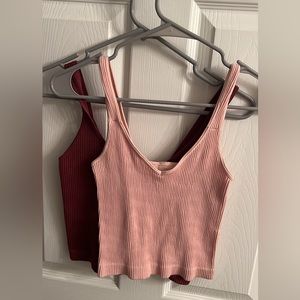 Two one size fits all tank tops! From a boutique.